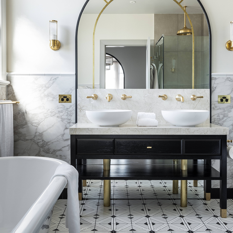 HG Bathroom with black cabinet vanity gold taps